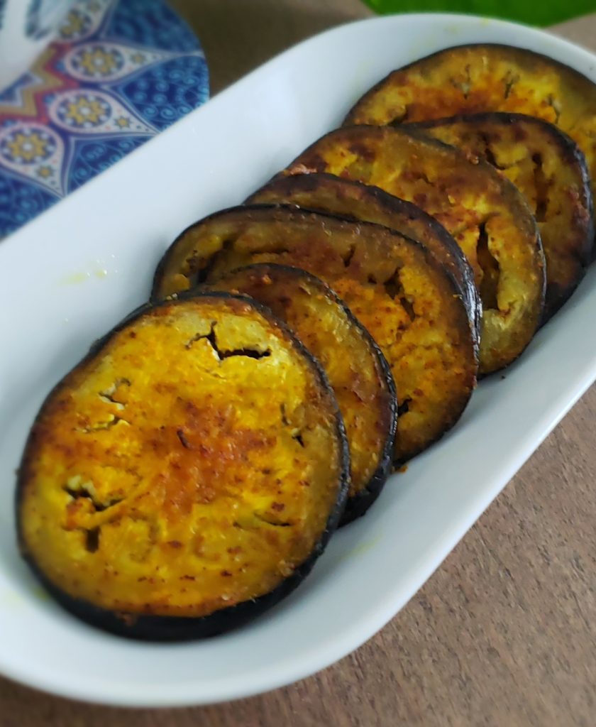 Thumb of begun bhaja (fried eggplant)